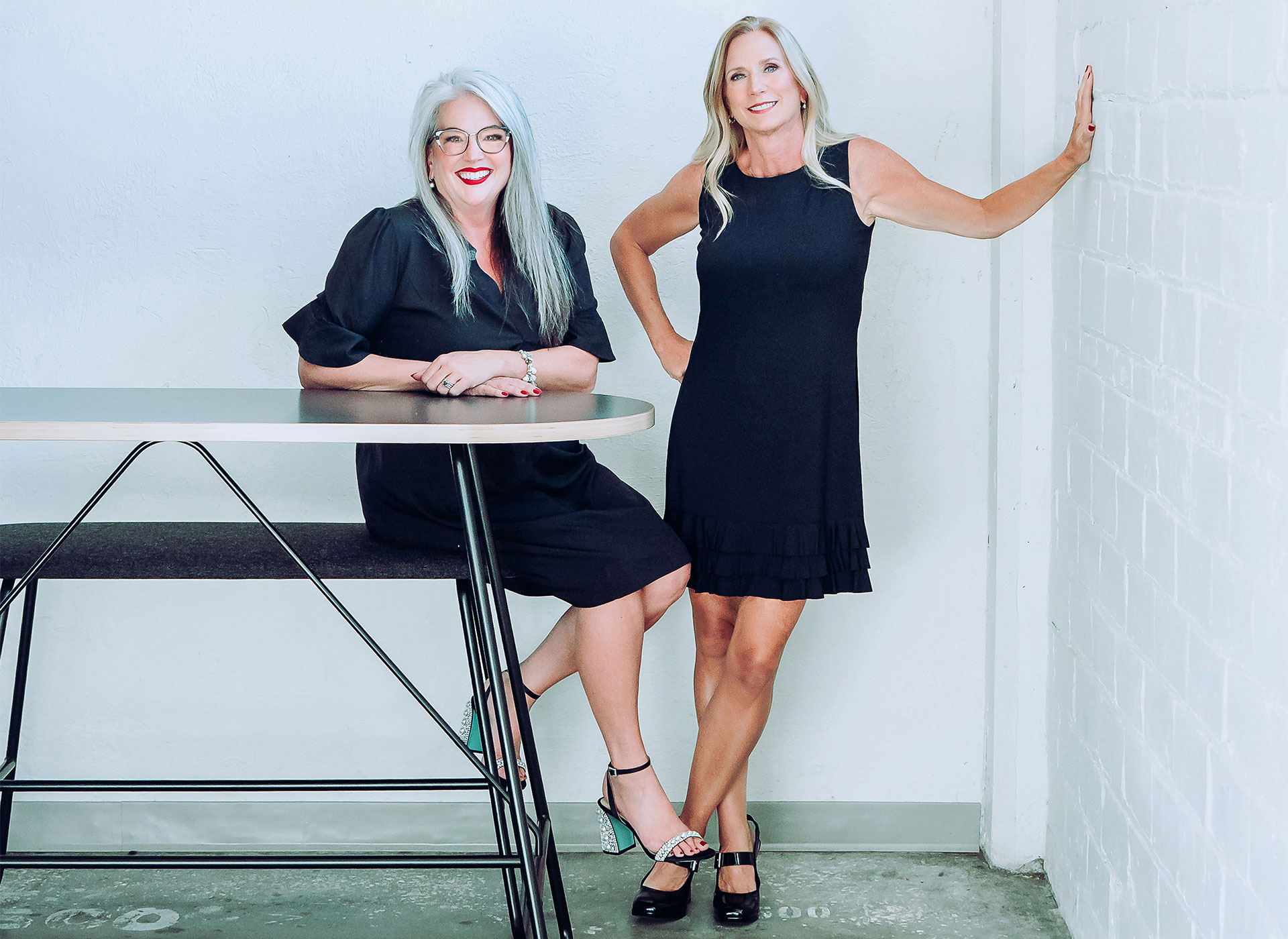 Paragon Interiors leadership Mary and Linda in black dresses